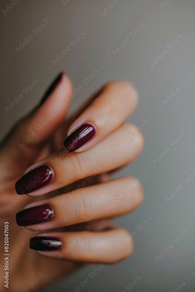 fingernails painted in a plum colored polish fingernails painted in a plum colored polish