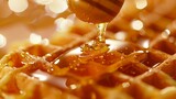 Close-up of honey being poured onto a waffle, isolated background, studio lighting, perfect for advertising, sharp focus and clarity