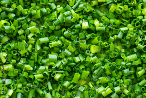 Top view of thinly chopped chives as a food background texture.
