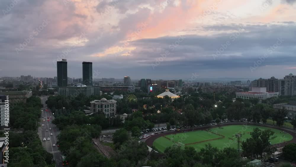 Aerial view of the central part of the Kazakh city of Almaty on a spring evening at sunset Aerial view of the central part of the Kazakh city of Almaty on a spring evening at sunset