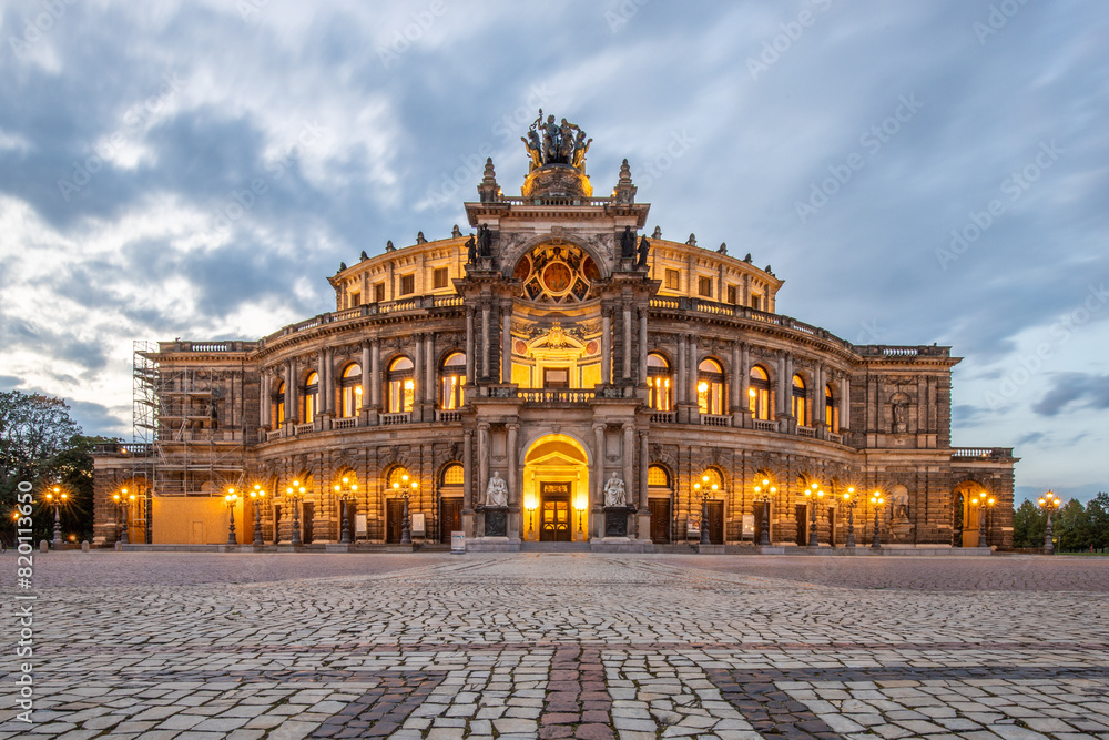 The Semperoper, the royal court and state opera of Saxony. The opera is located on Theaterplatz in the historic city center. Sunset at the architectural baroque building. Dresden, Saxony, Germany The Semperoper, the royal court and state opera of Saxony. The opera is located on Theaterplatz in the historic city center. Sunset at the architectural baroque building. Dresden, Saxony, Germany