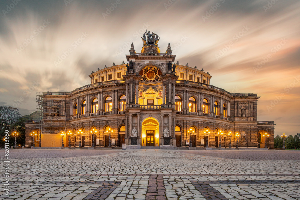 The Semperoper, the royal court and state opera of Saxony. The opera is located on Theaterplatz in the historic city center. Sunset at the architectural baroque building. Dresden, Saxony, Germany The Semperoper, the royal court and state opera of Saxony. The opera is located on Theaterplatz in the historic city center. Sunset at the architectural baroque building. Dresden, Saxony, Germany