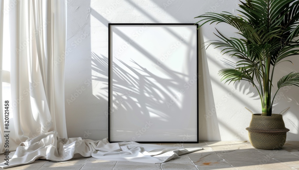 A black thin wooden photo frame was next to it, with white curtains blowing gently in the wind. The style was minimalistic, with a large blank poster inside the frame and empty A black thin wooden photo frame was next to it, with white curtains blowing gently in the wind. The style was minimalistic, with a large blank poster inside the frame and empty