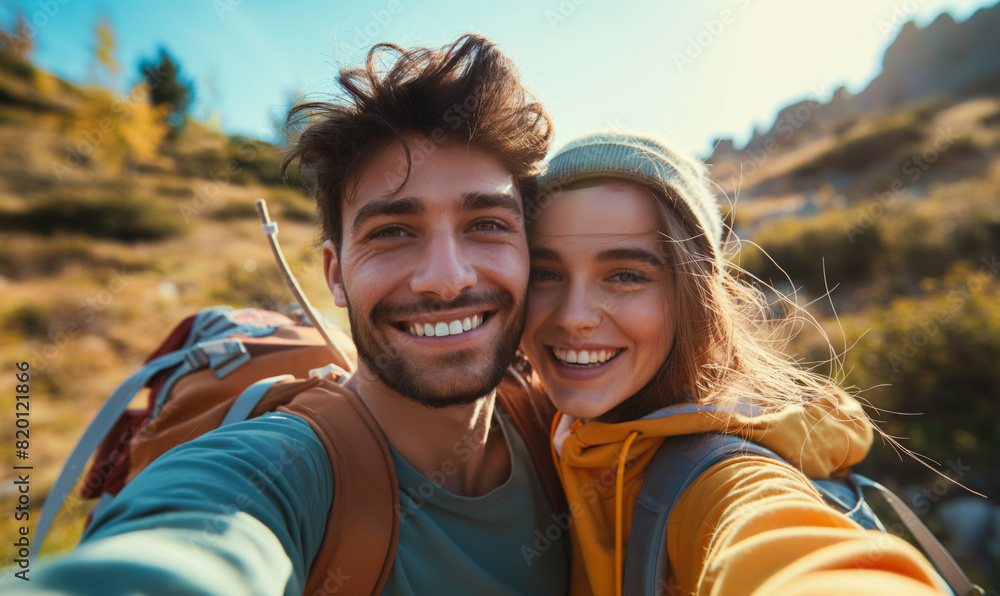 A young couple takes a selfie. Selfie against the backdrop of nature. Autumn nature in the background.