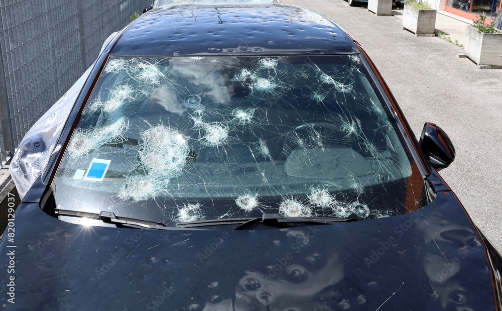 custom made wallpaper toronto digitalWindshield and body of a car severely damaged by hailstorm. Front view of unrecognizable vehicle..