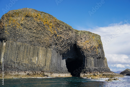 The entrance to Fingal`s Cave on Staffa. Fingal`s Cave is a sea cave on the uninhabited island Staffa in Scotland.  photo