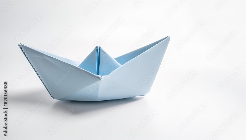 aquatic water transportation concept paper origami isolated on white background of a boat, with copy space, simple starter craft for kids aquatic water transportation concept paper origami isolated on white background of a boat, with copy space, simple starter craft for kids