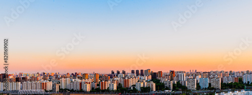Panorama of a big city at sunset from above. Multi-storey buildings in the Khovrino district  Moscow. Selected focus. A place to copy a space