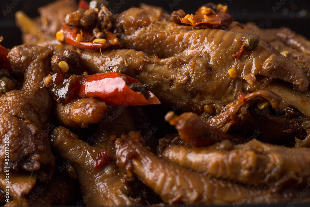 Close up view of Chinese food spicy chicken claws Close up view of Chinese food spicy chicken claws