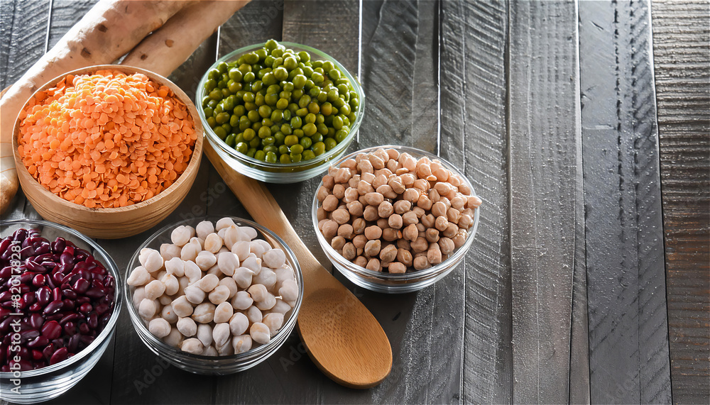 Various assortment of indian legumes in bowls - beans, chickpeas, lentils, dal top view. Vegetable proteins. Vegan food. Healthy eating concept.