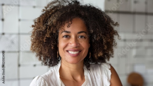 A Smiling Woman with Curly Hair