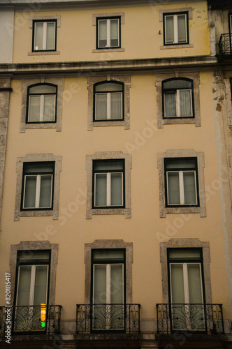 Building facade with windows and balconies typical of Lisbon, Portugal