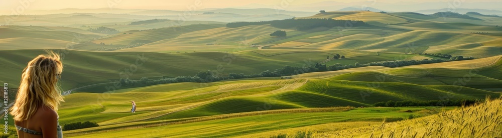 Woman Admiring Green Rolling Hills Landscape. Woman Admiring Green Rolling Hills Landscape.