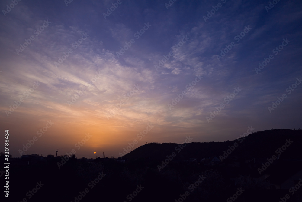 Beautiful nightly cityscape with moody sky at the sunset. Beautiful nightly cityscape with moody sky at the sunset.
