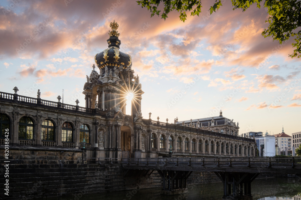 The Dresden Zwinger, a landmark of Baroque architecture. Historical buildings in the style of a castle. Orangery at sunrise in the morning in the city of Dresden, Saxony, Germany The Dresden Zwinger, a landmark of Baroque architecture. Historical buildings in the style of a castle. Orangery at sunrise in the morning in the city of Dresden, Saxony, Germany