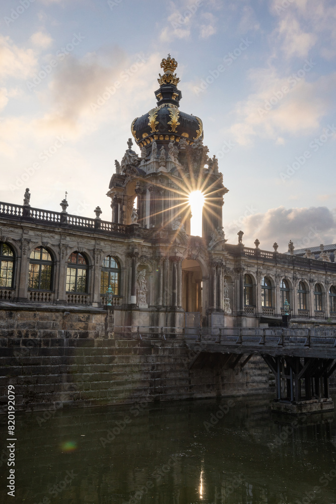 The Dresden Zwinger, a landmark of Baroque architecture. Historical buildings in the style of a castle. Orangery at sunrise in the morning in the city of Dresden, Saxony, Germany The Dresden Zwinger, a landmark of Baroque architecture. Historical buildings in the style of a castle. Orangery at sunrise in the morning in the city of Dresden, Saxony, Germany
