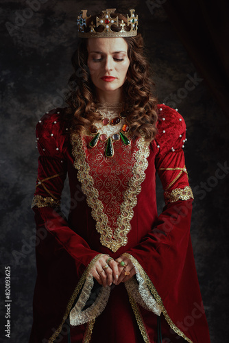 medieval queen in red dress with crown