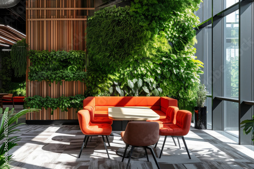 Bright open space area for relax with green vertical plants wall in modern co-working office building © vejaa