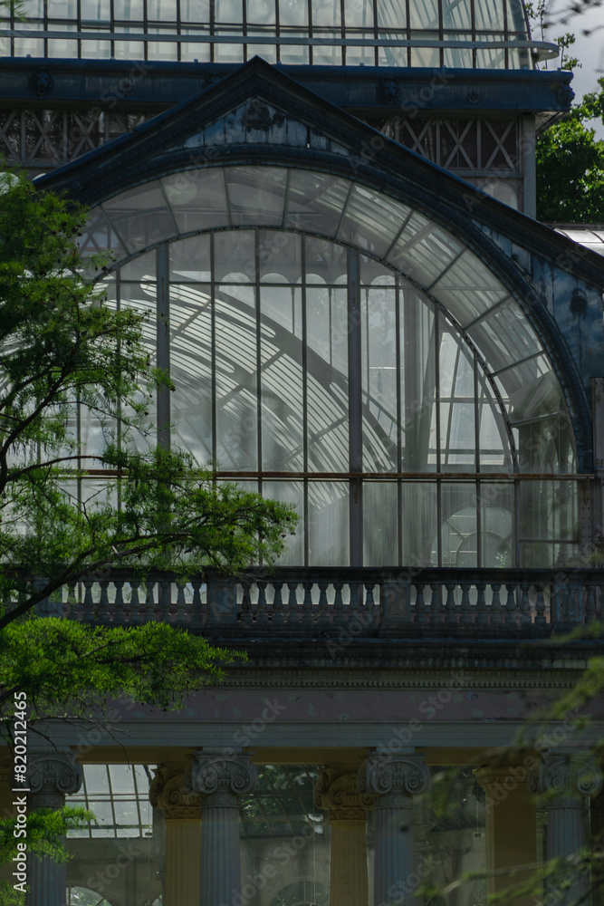 Fototapeta premium Photograph of the Crystal Palace in El Retiro park. Architecture. City of Madrid. Green area. European tour