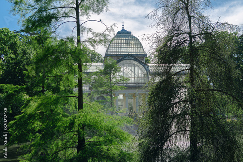 Photograph of the Crystal Palace in El Retiro park. Architecture. City of Madrid. Green area. European tour