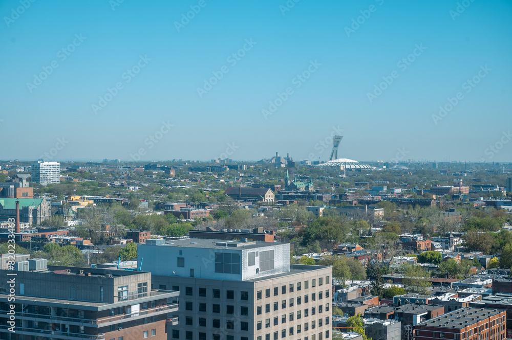 High panoramic view of Olympic Stadium, at Olympic Park in the Hochelaga-Maisonneuve district of the city, the world's tallest inclined tower, Angus neighbourhood, Quebec, Canada (May 2024).