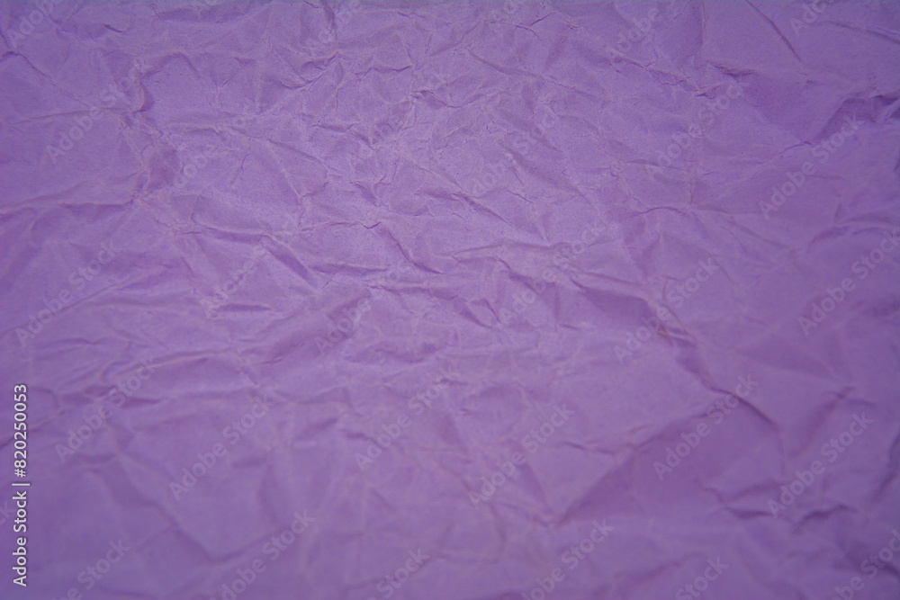 Purple background with dense wrinkles. Purple recycled kraft paper texture as background. Purple background with dense wrinkles. Purple recycled kraft paper texture as background.