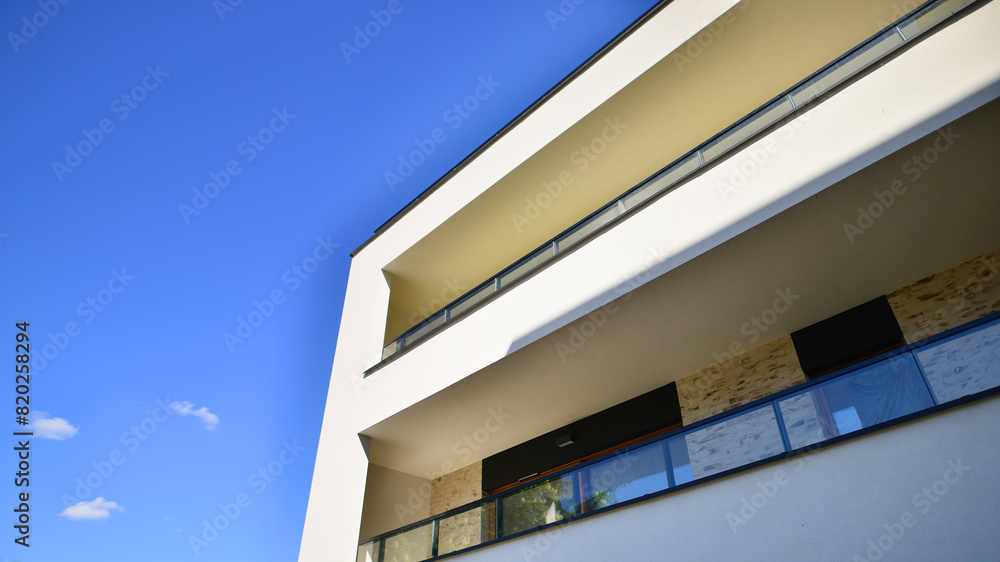 Fototapeta premium New contemporary residential construction architecture background. Modern house facade exterior.