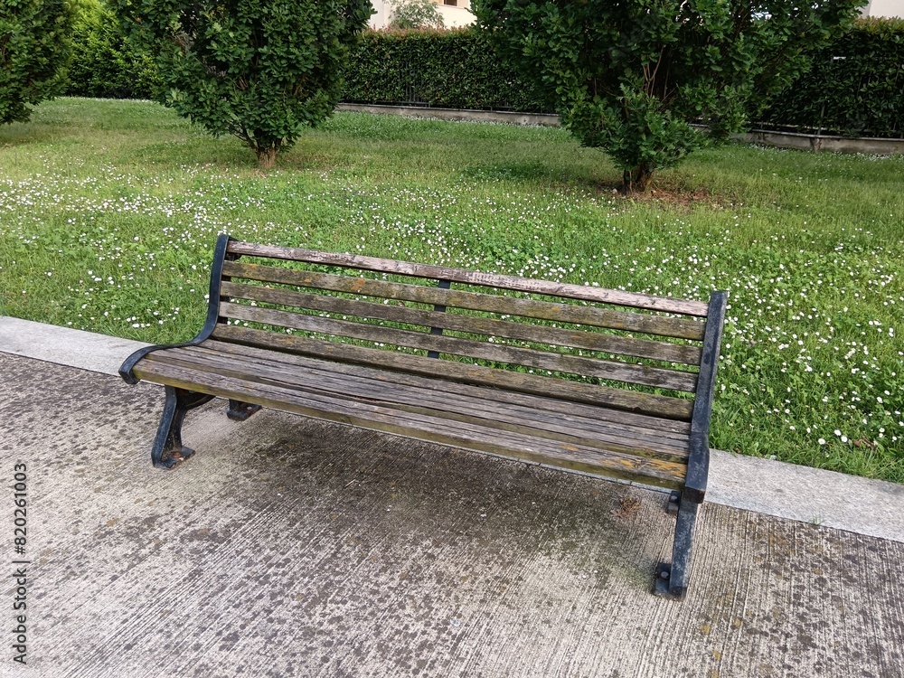 Side view of the bench in the park Side view of the bench in the park