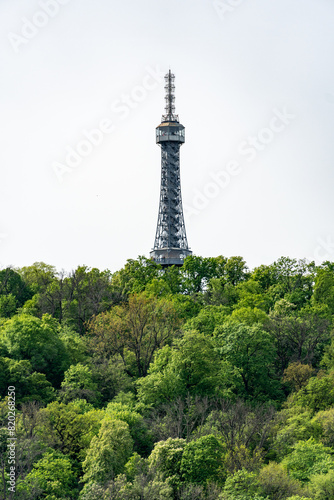 Prague, Czech Republic - Petrin observation tower in Prague located in a park among trees on a hill above the city.