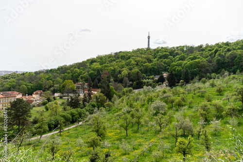 Prague, Czech Republic - Petrin observation tower in Prague located in a park among trees on a hill above the city.