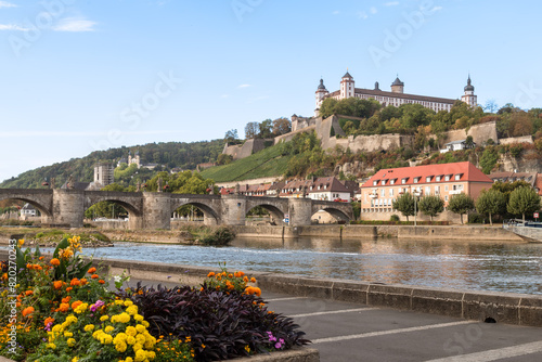 Main river with a view of the medieval bridge, Alte mainbrücke and fortress Marienberg in the historic city of Würzburg.