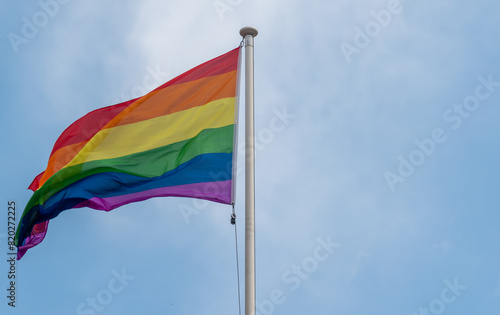 flag of rainbow,Rainbow flags, Flag for LGBT, LGBTQ or LGBTQIA+ Pride, The rainbow LGBTQ flags flies in the blue sky