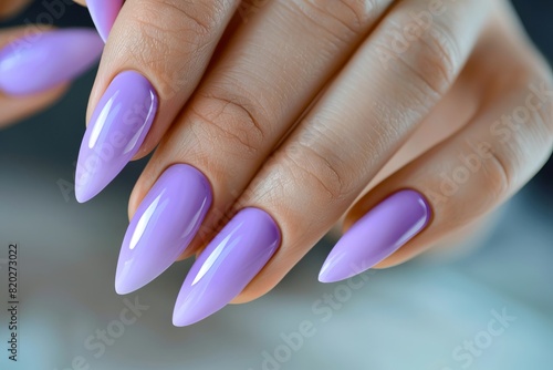 A woman with purple stiles and white nails.