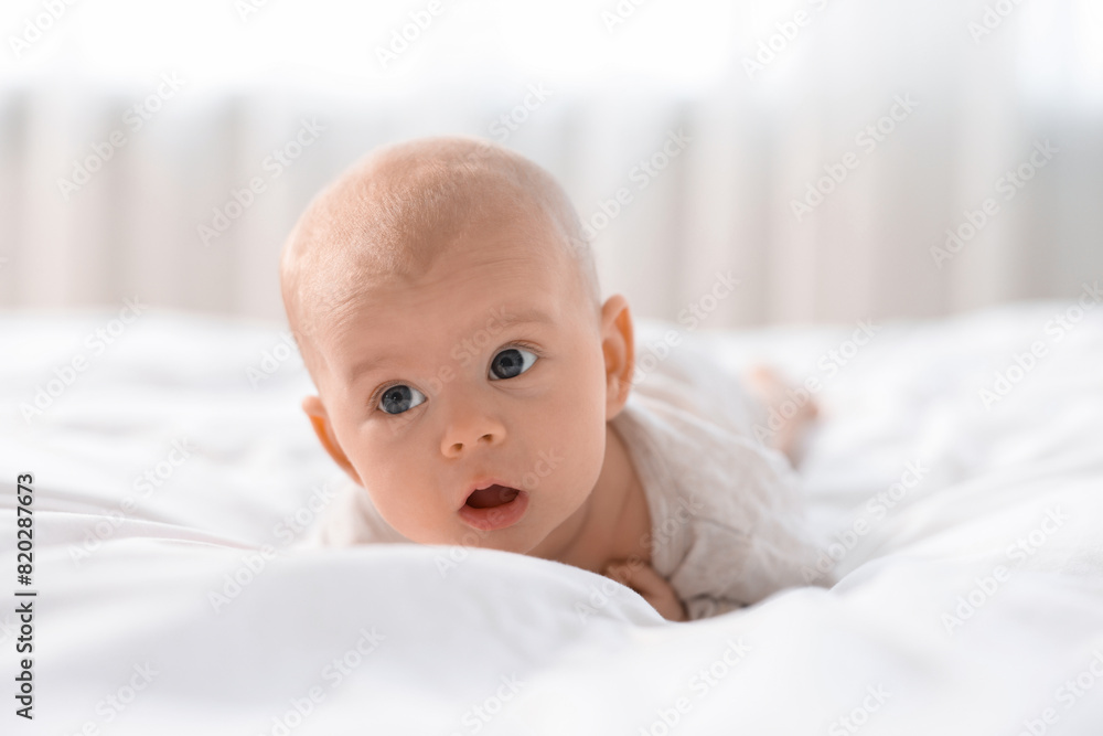 Cute little baby lying on white sheets Cute little baby lying on white sheets