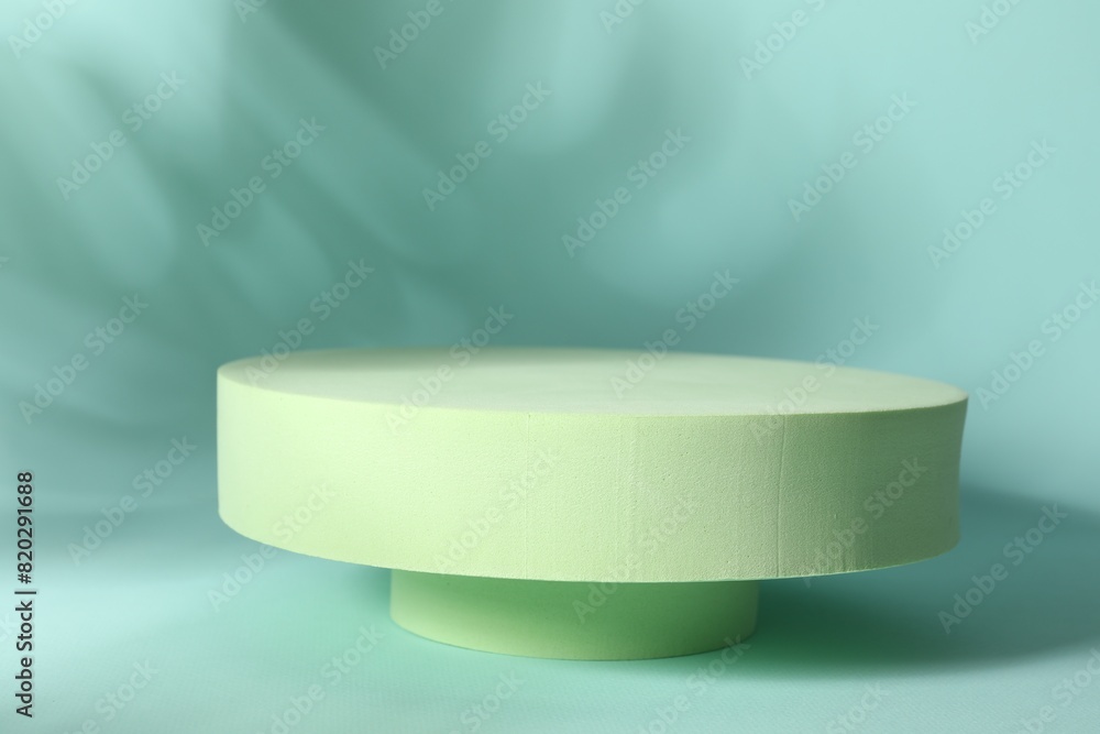 Presentation of product. Podiums and shadows on turquoise background. Space for text Presentation of product. Podiums and shadows on turquoise background. Space for text
