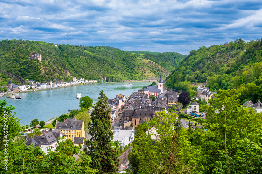 View over towns Sankt Goar and Sankt Goarshausen on bank of Rhine River in Rhineland-Palatinate, Germany. Rhine valley is famous tourist destination for romantic river cruise and short vacation