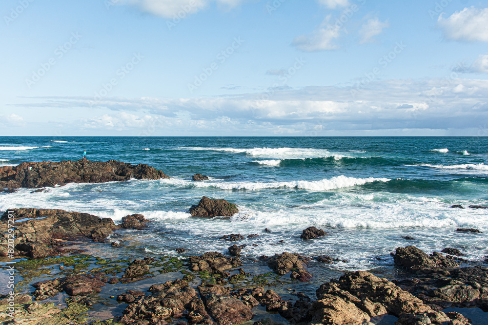 View of a beautiful beach with rocks at the seaside. View of a beautiful beach with rocks at the seaside.