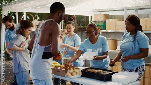 Fotografija At homeless shelter, humanitarian aid group is involved in distribution of donations to those in need