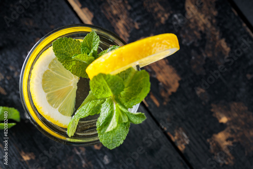 Lemonade with Fresh Mint and Lemon on Old Boards, Healthy Summertime Drink