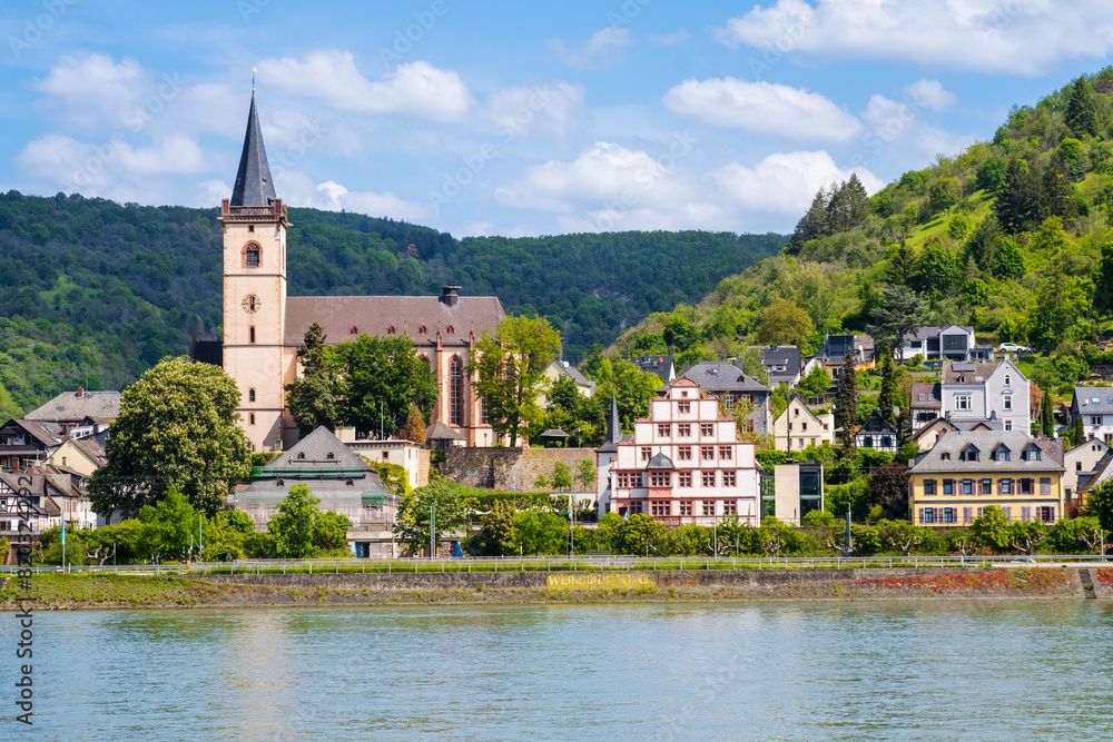 Lorch am Rhein town in Rhine Valley, Germany. Lorch village and St. Martin church seen from river in Hesse region. Rhine valley is famous tourist destination for romantic river cruise or vacation