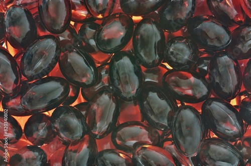 Antarctic krill oil Omega 3 capsules supplements scattered pills health concept. 