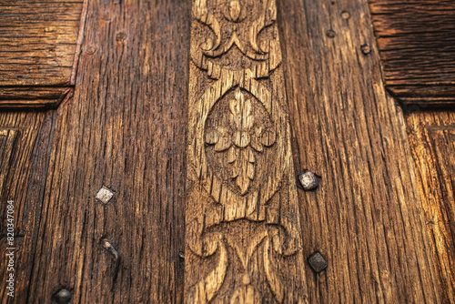 Detail of the carved wood on the door of the church.