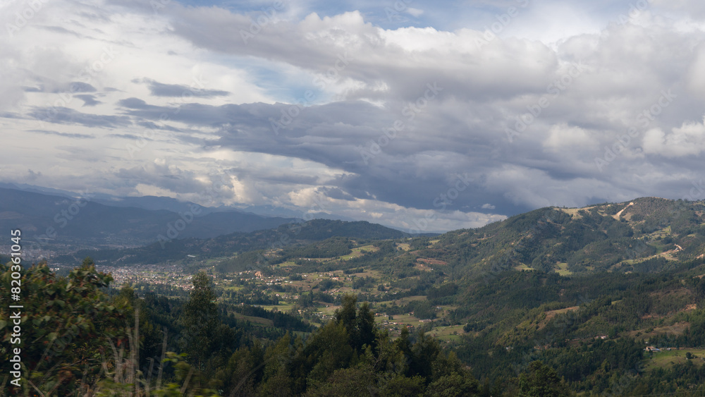mountainous landscape with town in the background mountainous landscape with town in the background