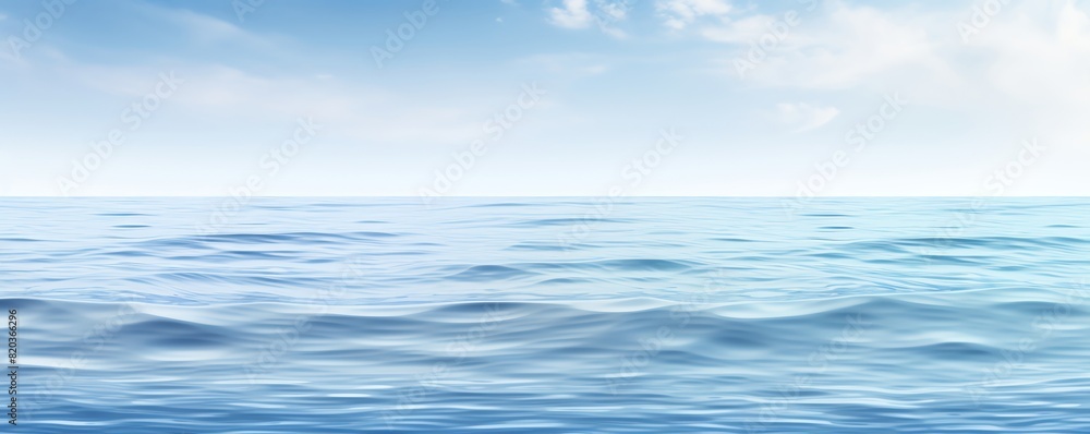 Blue ocean under bright sunny sky with white clouds