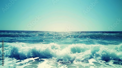 the concept of World Ocean Day. Beautiful nature landscape. World Water Day. A vast ocean with waves, turquoise water, and a clear sky in the distance. 