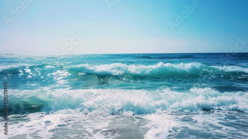 the concept of World Ocean Day. Beautiful nature landscape. World Water Day. A vast ocean with waves  turquoise water  and a clear sky in the distance. 