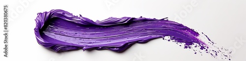A stroke of purple paint thickly painted on a white background.  photo
