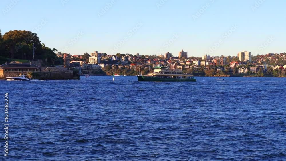 Sydney Harbour forshore viewed from the Gardens in NSW Australia on a nice sunny and partly cloudy afternoon blue skies Sydney Harbour forshore viewed from the Gardens in NSW Australia on a nice sunny and partly cloudy afternoon blue skies