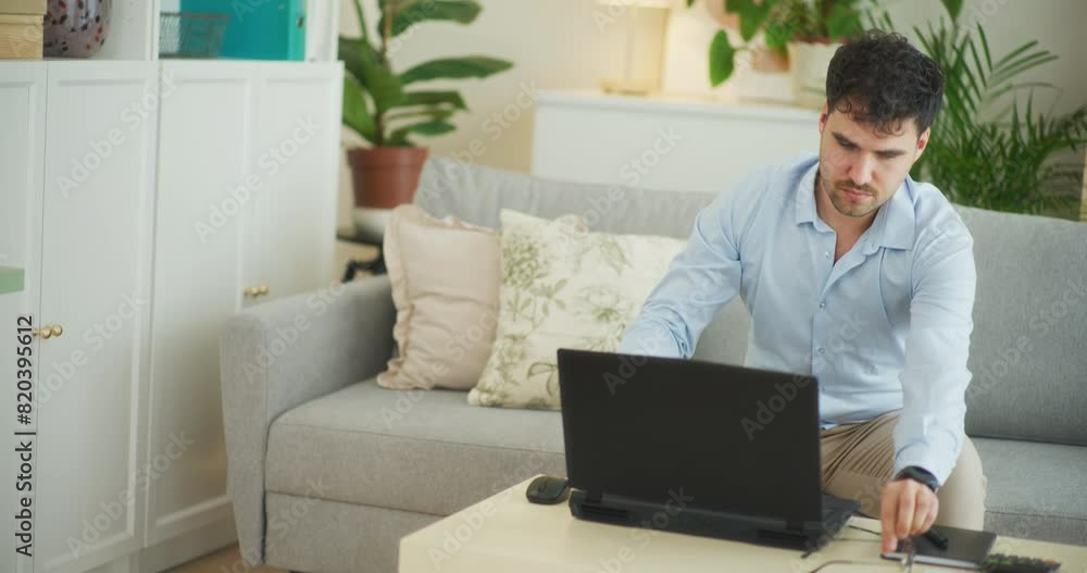 Businessman Opens Laptop Puts on Glasses and Starts Working Businessman Opens Laptop Puts on Glasses and Starts Working