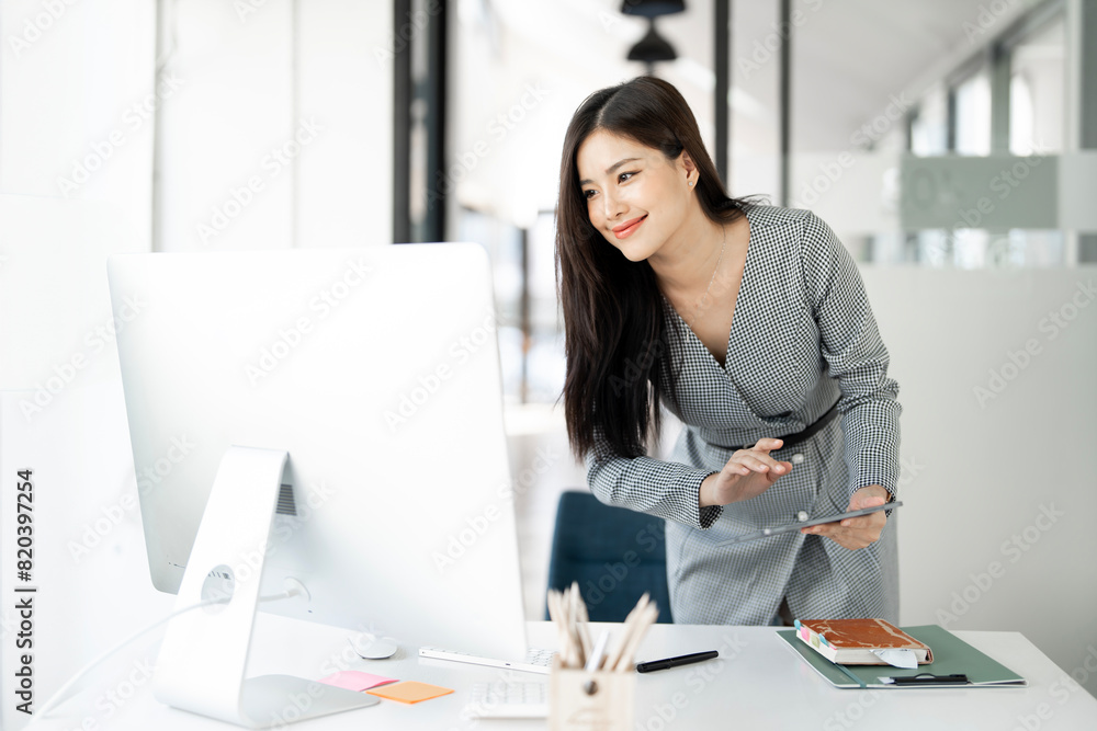Image of young beautiful joyful woman smiling while working in office Image of young beautiful joyful woman smiling while working in office